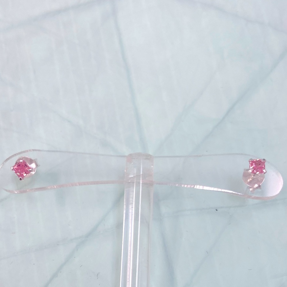 Tiny 925 silver coated pink stud earrings. New not used.